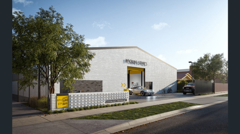 Exterior view of Hocking Stores mini warehouse development in Coburg North, Melbourne, with roller door and street signage